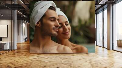 Lifestyle portrait of attractive couple in love on honeymoon vacation relaxing in hot tub pool at luxury resort spa Wall mural