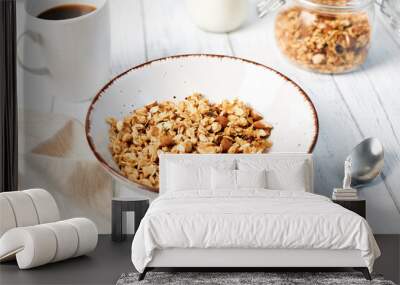 Granola with nuts and a cup of coffee for breakfast. Balanced diet for vegetarians or vegans Wall mural