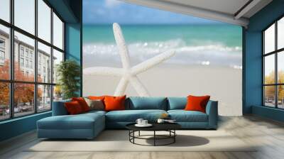 white starfish on white sand beach, with ocean sky and seascape Wall mural