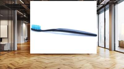 Black toothbrush on white background Wall mural