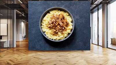 Polenta with chanterelles on a black background. Wall mural