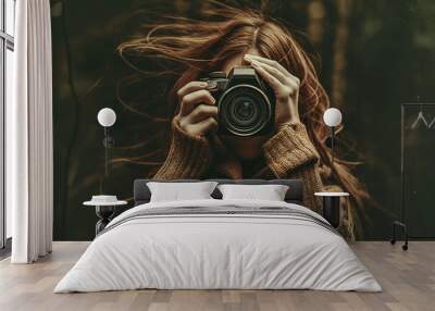 Redhead woman photographer behind the camera Wall mural