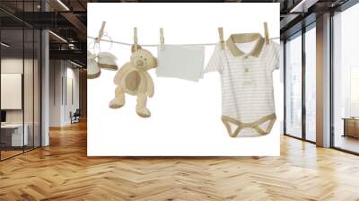 Baby goods and blank note hanging on the clothesline Wall mural