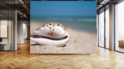 sea beautiful shell with white edges and purple back lies horizontally on yellow sand against the background of blue sea and white wave blue sky summer vacation vacation summer day heat beach beach Wall mural