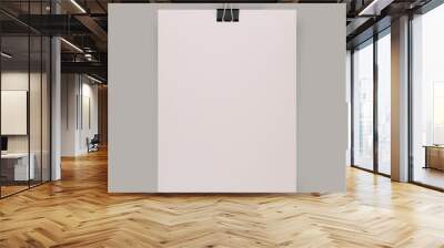 Sheet of paper with binder clips isolated on a gray background Wall mural