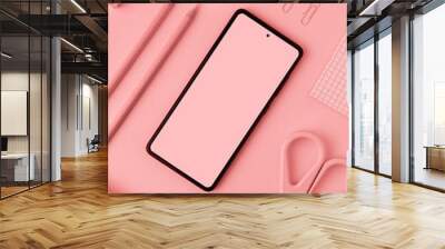 Monochrome pink flat layout of office workplace with stationery. Phone mockup, notepads, pencils, paper clips, scissors, tube and pencil sharpener are on pink background. Wall mural