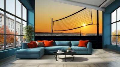 Sillhouette of a volleyball net against sunset on the beach Wall mural