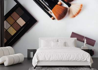 Top view on palette of shadows and makeup brushes on a white background close up Wall mural