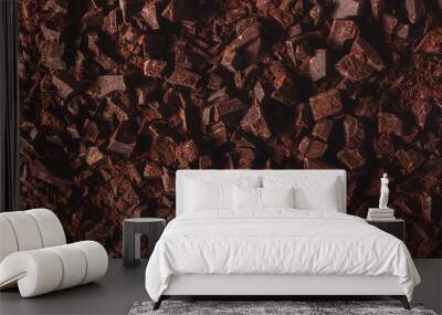 Flat lay view of dark chocolate chopped. Texture of cracked chocolate with copy space. Wall mural