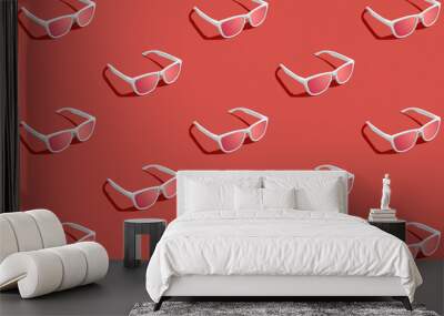 Pattern of red sunglasses with red gradient background. Studio shot. Wall mural