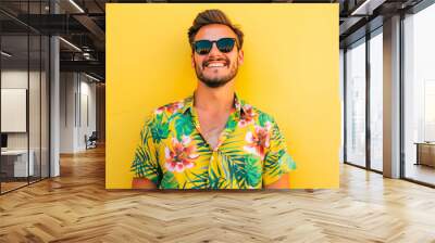 Summer fashion portrait of young man wearing hawaiian shirt over yellow background. Colourful summer style portrait with empty space for text or product presentation. Wall mural