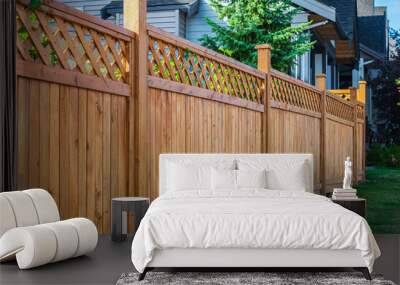 Nice new wooden fence around house. Wooden fence with green lawn. Street photo Wall mural