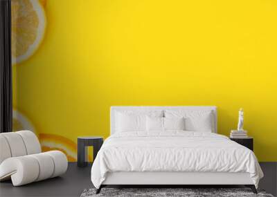 Juicy citrus on a yellow background. Bright vitamin photo. Copy space, web-banner format. Wall mural