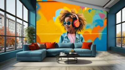 Young girl listening to music on colorful background. Child wearing headphones. Wall mural