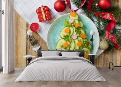 New year meal idea Christmas tree from a salad olivier on a rustic table. Wall mural