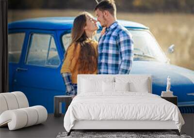 A young couple travel with the Siberian Husk. Wall mural