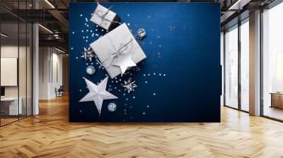 Christmas and New Year holiday background. Xmas greeting card. Christmas silver gifts on blue background top view. Flat lay Wall mural