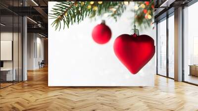 Red christmas ornaments, heart and ball, on the xmas tree on glitter bokeh background with twinkle lights. Merry christmas card. Winter holiday theme. Happy New Year. Wall mural