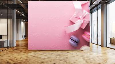 Valentine's Day. Pink gifts tied with rosy ribbon and macaron macaroon cookie on pink heart shaped background top view. Valentines Day, 8 March, Women's Day, Birthday, Mother's Day holiday background Wall mural