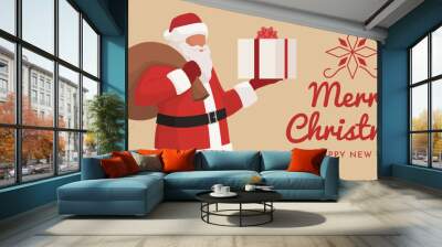 Happy Santa Claus carrying a Christmas gift Wall mural