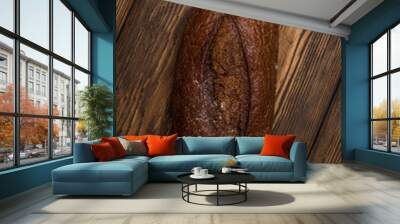 Fresh Rustic Black Bread On Wooden Background Top View. Wall mural