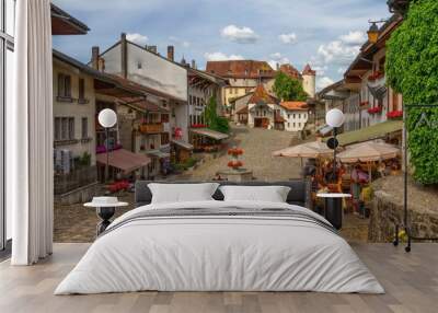 Main street in Gruyere village in Fribourg canton by beautiful day, Switzerland Wall mural