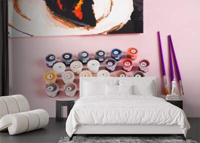 Set of colorful acrylic paints, brushes and canvas for painting by numbers on the pink table Wall mural