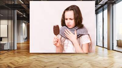 The girl bit off the ice cream and her throat ached Wall mural