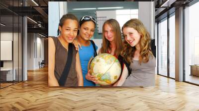 Portrait of a group of young smiling school girls  Wall mural