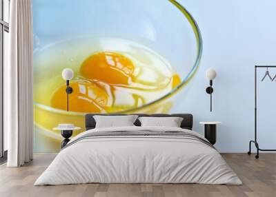 Raw eggs in a glass bowl close up Wall mural