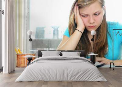 teenage girl studying with textbooks Wall mural