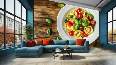 Delicious tortellini pasta with tomatoes basil on wooden background Wall mural