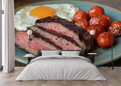 Juicy steak with roasted tomatoes fried egg on plate Wall mural