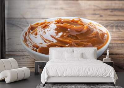 Boiled condensed milk in a plate. Sweet pasta spread for Breakfast and dessert. Copy space. Wall mural