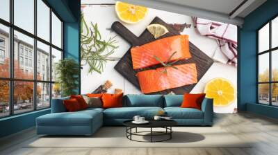 Salmon fillet, red salted fish on a wooden chopping Board. Lemon, rosemary spices. Copy space. Wall mural