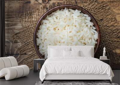 White boiled rice in a wooden bowl. Rustic style. Wall mural