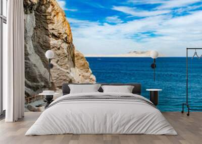 seascape with rocks on shore at day Wall mural