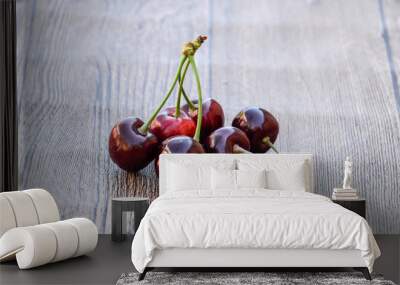 Cherry berries on a wooden background. Ripe red sweet cherry Wall mural