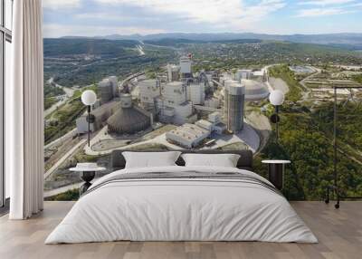 Verkhnebakansky cement plant, top view. Factory for the production and preparation of building cement. Cement industry. Wall mural