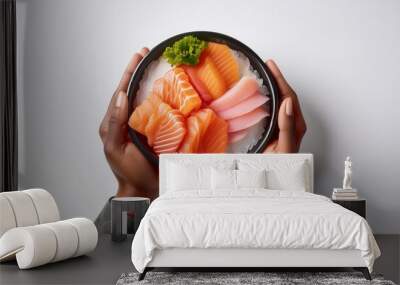 Anonymous hands of person holding sashimi with white background isolated Wall mural