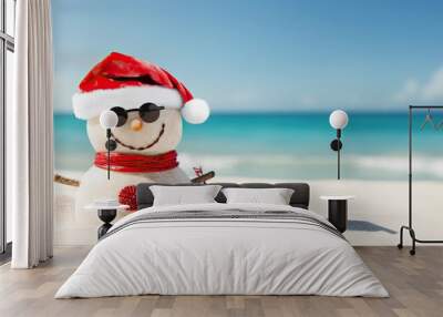 Smiling sandy snowman in red santa hat on the sea beach, x-mas travel design background, Christmas decoration, Happy New Year, holiday,vacation, love of the season, space for text Wall mural