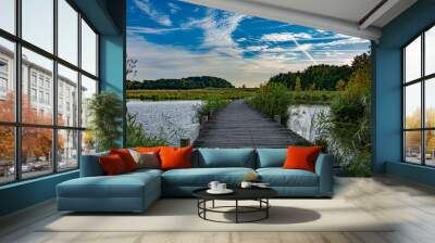 Beautiful pathway through the water in the nature on a blue sky day Wall mural