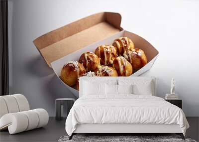 Takoyaki in delivery box with white background isolated Wall mural