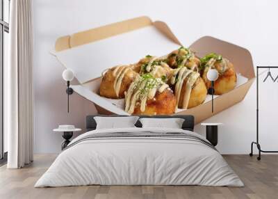 Takoyaki in delivery box with white background isolated Wall mural