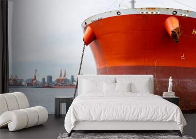 The bow of a container ship which is anchored in Vancouver Harbour with the Vancouver, British Columbia skyline in the background. Wall mural