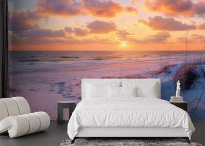 A beautiful panoramic photograph capturing a serene winter sunset over a snow-covered beach. The sky is filled with vibrant hues of pink, orange, and purple, contrasting with the white snow Wall mural