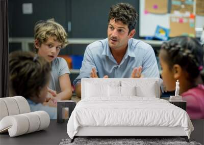 A man seated at a table engaging a group of children in a vibrant classroom setting Wall mural