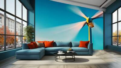 A modern wind turbine spins gracefully against a clear blue sky, symbolizing the advancement of renewable energy and sustainability in an environmentally conscious world Wall mural