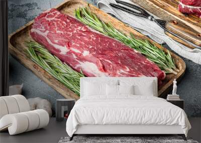 Fresh and raw beef meat. Whole piece of tenderloin with steaks, on gray stone background Wall mural