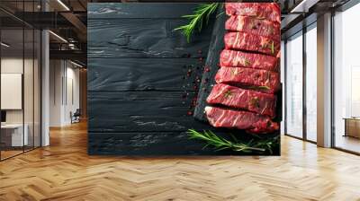 Fresh raw Black Angus beef steaks seasoned with herbs and spices on a wooden cutting board Wall mural